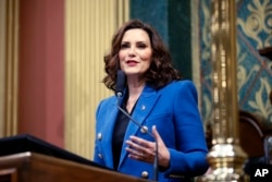 FILE - Michigan Governor Gretchen Whitmer delivers her State of the State address to a joint session of the House and Senate at the state Capitol in Lansing, Michigan, Jan. 25, 2023.