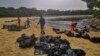 Singapore rushes to clean up oil slick after boat hits fuel supply ship 
