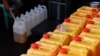 A worker fills jerrycans with cooking oil at a distribution station in Jakarta, Indonesia, May 20, 2022. REUTERS/Willy Kurniawan