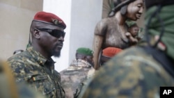 FILE - Guinea junta leader Col. Mamady Doumbouya, leaves a meeting with an ECOWAS delegation in Conakry, Guinea, Sept. 10, 2021. Authorities recently dissolved dozens of political parties.