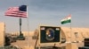 FILE - U.S. and Niger flags flutter side by side at a base camp supporting the construction of Niger Air Base 201 in Agadez, Niger, April 16, 2018.