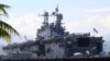 FILE - The amphibious assault ship USS Peleliu is seen docked following joint exercises at the Alava pier, off Subic Bay Freeport zone, northwestern Philippines, Oct. 13, 2014, as part of the Visiting Forces Agreement.