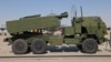 ​ຖານ​ຍິງ​ລູກ​ຈະ​ຫຼວດ M142 HIMARS​ຂອງ​ສະ​ຫະ​ລັດ ທີ່​ຈອດ​ຕັ້ງ​ຢູ່ບ່ອນ​ສະ​ແດງ​ ໃນ​ດູ​ໄບ ປີ 2021 ໃນ​ສະ​ຫະ​ລັດ​ອາ​ຣັບ​ເອ​ເມີ​ເຣັດ ວັນ​ທີ 15 ພ​ະ​ຈິກ 2021 