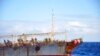 FILE - The Chinese squid fishing vessel Fu Yuan Yu 7880 sails on the Pacific Ocean on July 18, 2021. The Pingtan-affiliated vessel was arrested by South Africa in 2016 after it tried to flee a naval patrol that suspected it of illegal squid fishing. 