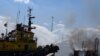 Firefighters work at a site of a Russian missile strike in a sea port of Odesa, as Russia's attack on Ukraine continues, Ukraine, July 23, 2022.