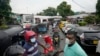 People wait in a long queues to buy fuel for their vehicles at a filling station in Colombo, Sri Lanka, June 11, 2022. 