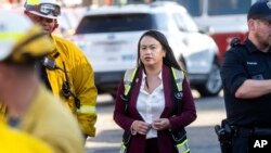 FILE - Oakland Mayor Sheng Thao visits emergency responders battling the Keller Fire in Oakland, Calif., Oct. 18, 2024. 
