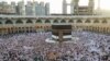 Muslim worshippers gather before the Kaaba at the Grand Mosque in Saudi Arabia's holy city of Mecca, Saudi Arabia, July 2, 2022. 