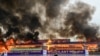 Smoke rises from a burning pile of seized illegal drugs during a destruction ceremony to mark the United Nations' "International Day against Drug Abuse and Illicit Trafficking" in Yangon, Myanmar, June 26, 2022. 
