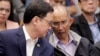 Former chief of the Philippine PNP-CIDG and now Mayor Benjamin Magalong, right, talks to Justice Secretary Menardo Guevarra at the resumption of the Senate probe Oct. 9, 2019 in suburban Pasay city south of Manila, Philippines. 