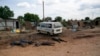 FILE - Slain bodies of civilians killed in renewed attacks lie along a road in Bentiu, Unity state of South Sudan.