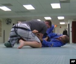 For instructor Luis Pantoja (right on floor) , teaching injured soldiers Brazilian Jiu Jitsu has been a learning process for him as well.