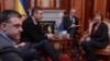 Ukrainian opposition leader Oleg Tjagnibok, left, and Ukrainian lawmaker and chairman of the Ukrainian opposition party Udar (Punch), former WBC heavyweight boxing champion Vitali Klitschko, second left, during their talks with EU foreign policy chief Catherine Ashton, Feb. 24, 2014.