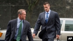 Former Blackwater Worldwide guard Evan Liberty, right, arrives at federal court in Washington, D.C., June 11, 2014.