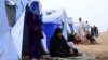 Fleeing insurgents, refugees from the Iraqi city of Mosul find shelter at Khazir camp near Irbil on June 12, 2014.