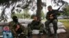 Armed militiamen supporting the self-proclaimed Donetsk People's Republic guard a checkpoint in the eastern Ukrainian city of Donetsk, June 1, 2014.