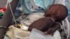 FILE - A child is treated for cholera in South Sudan. 