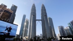 FILE - Roads are deserted during a lockdown due to the coronavirus outbreak, in Kuala Lumpur, Malaysia, June 1, 2021. 
