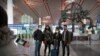 Wall Street Journal China Bureau Chief Jonathan Cheng, left, poses for a photo with Journal reporters, from left, Julie Wernau, Stephanie Yang, and Stu Woo before their departure at Beijing Capital International Airport in Beijing, March 28, 2020.