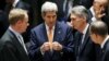 From left, British Ambassador to the U.N. Matthew Rycroft, U.S. Secretary of State John Kerry, Britain's Foreign Secretary Philip Hammond, U.N. Secretary General Ban Ki-moon speak before a meeting of the U.N. Security Council in New York, Dec. 18, 2015. 