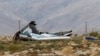 Wreckage lies near the site where a Virgin Galactic space tourism rocket, SpaceShipTwo, exploded and crashed in Mojave, Calif., Oct. 31, 2014. 