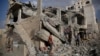FILE - Yemeni men inspect a house destroyed by a Saudi-led airstrike in Sanaa, Yemen, Monday, Jan. 25, 2016. 