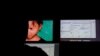 FILE - A Terre des Hommes researcher chats in a public chat room where users solicit fake 10-year-old Sweetie from the Philippines, top in a computer-generated image, in Amsterdam, Netherlands