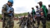 FILE - United Nations peacekeepers record details of weapons recovered from the Democratic Forces for the Liberation of Rwanda (FDLR) militants.