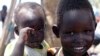 South Sudanese children displaced by fighting pose for a photo at a refugee camp in Jonglei, the country’s largest state, on April 29, 2014.