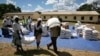 Zimbabwean villagers collect their monthly rations of food aid from Rutaura Primary School in the Rushinga district of Mt Darwin about 254km north of Harare, Zimbabwe, March 7, 2013. 