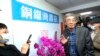 Lam Wing-kee, one of five shareholders and staff at the Causeway Bay Book shop in Hong Kong, waves to the press at his new book shop on the opening day in Taipei, Taiwan, April 25, 2020.