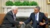 President Barack Obama (r) shakes hands with Palestinian President Mahmoud Abbas during their meeting in the Oval Office of the White House, March 17, 2014.