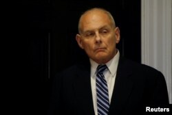 FILE - White House Chief of Staff John Kelly listens as President Donald Trump holds a round table meeting in the Roosevelt Room at the White House in Washington, March 20, 2018.
