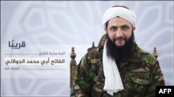 An image released July 28, 2016, by Al-Manara al-Bayda, the official news arm of Al-Nusra Front, al-Qaida's Syrian affiliate, allegedly shows the group's chief Abu Mohammad al-Jolani at an undisclosed location, in the first ever picture to be released of him.