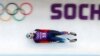 FILE - Russia's Semen Pavlichenko speeds down the track during a men luge training at the Sanki sliding center in Rosa Khutor, a venue for the Sochi 2014 Winter Olympics. 