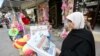 A Palestinian woman reads a local newspaper, which features the Israeli election on its front page, in Khan Younis, in the southern Gaza Strip, March 18, 2015. 