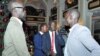 Grang Demebia (l), the son of late Sudanese politician John Garang, who is in the group supporting ousted Vice President Riek Machar, as Grang Demebiar arrives with unidentified delegates in Addis Ababa, Jan. 2, 2014.