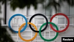 The Olympic rings are seen at the Paris La Defense Arena in Nanterre, outside Paris