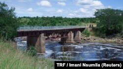 FILE - The Ruaha river water passes under a bridge in Kilolo district, Tanzania, June 14, 2017. 
