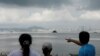 FILE - A tourist points China's Xiamen from a former military fort, ahead of the 60th anniversary of Second Taiwan Straits Crisis against China, on Lieyu island, Kinmen county, Taiwan, Aug. 20, 2018. 