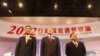Hong Kong Chief Executive candidates (L-R) Leung Chun-ying, Henry Tang and Albert Ho stand on the stage after a live television debate in Hong Kong, March 16, 2012.